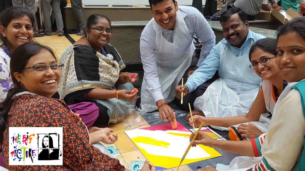 team building excellence. People smiling painting a picture together with purpose